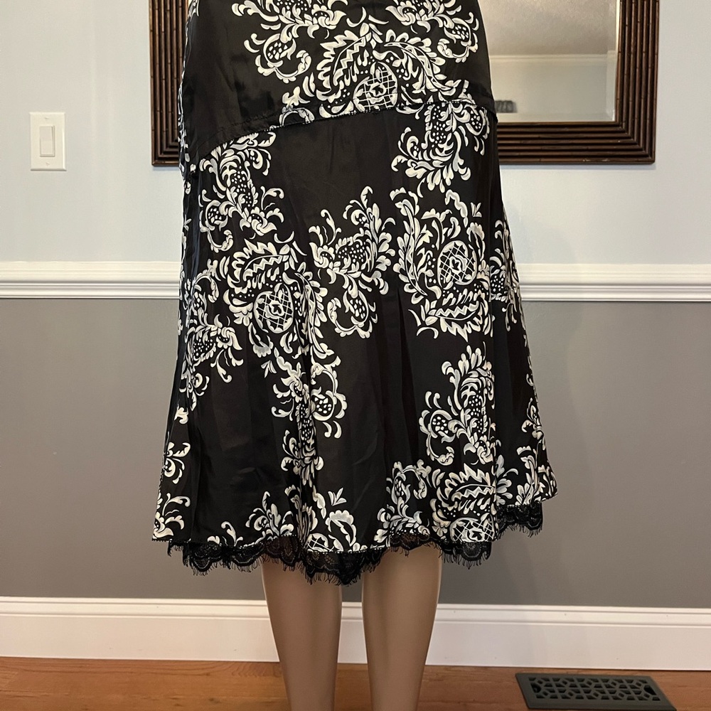 White House black market high low 100% silk skirt with lace trim.